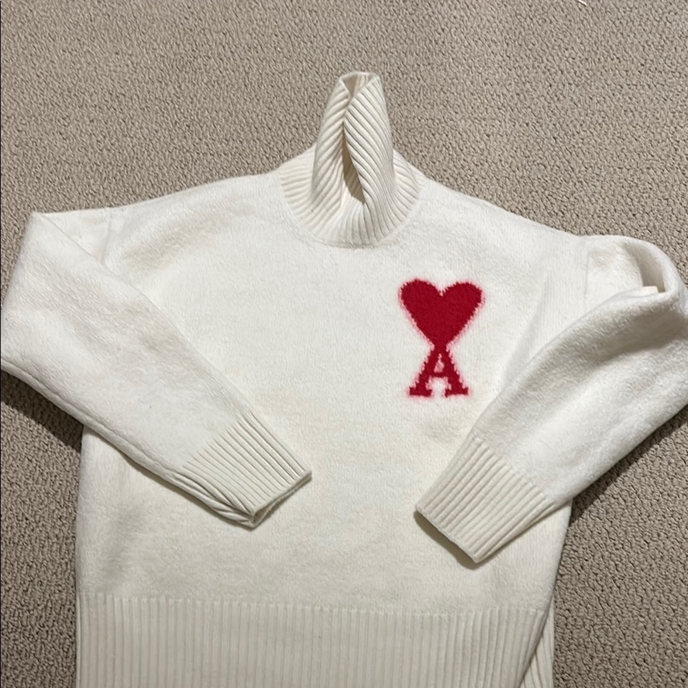 White Sweater with Red Heart Detail